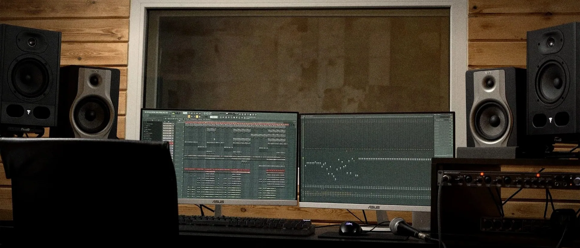 The Rush Production House control room: two screens running FL Studio between the studio monitors